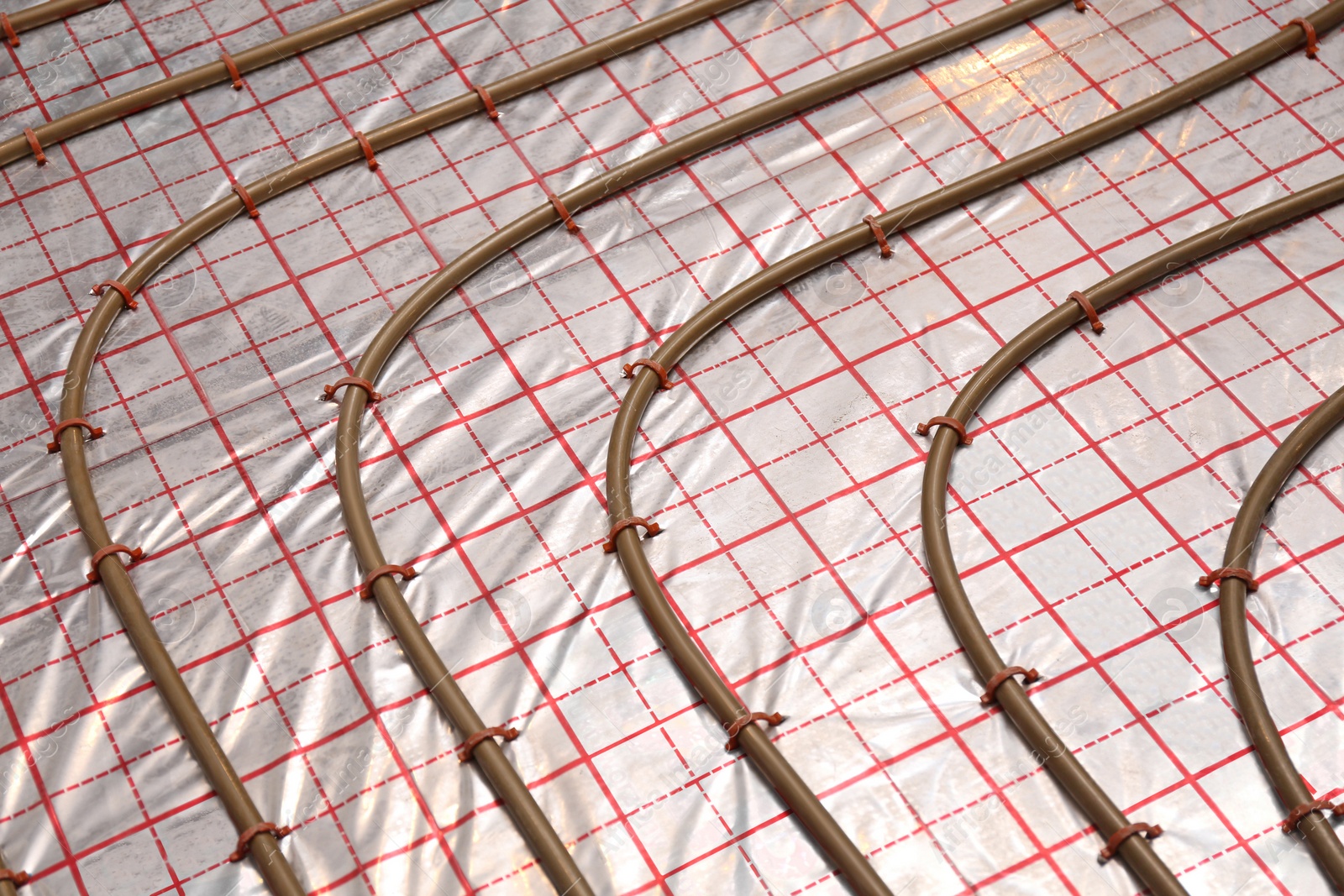 Photo of Installation of underfloor heating system in building