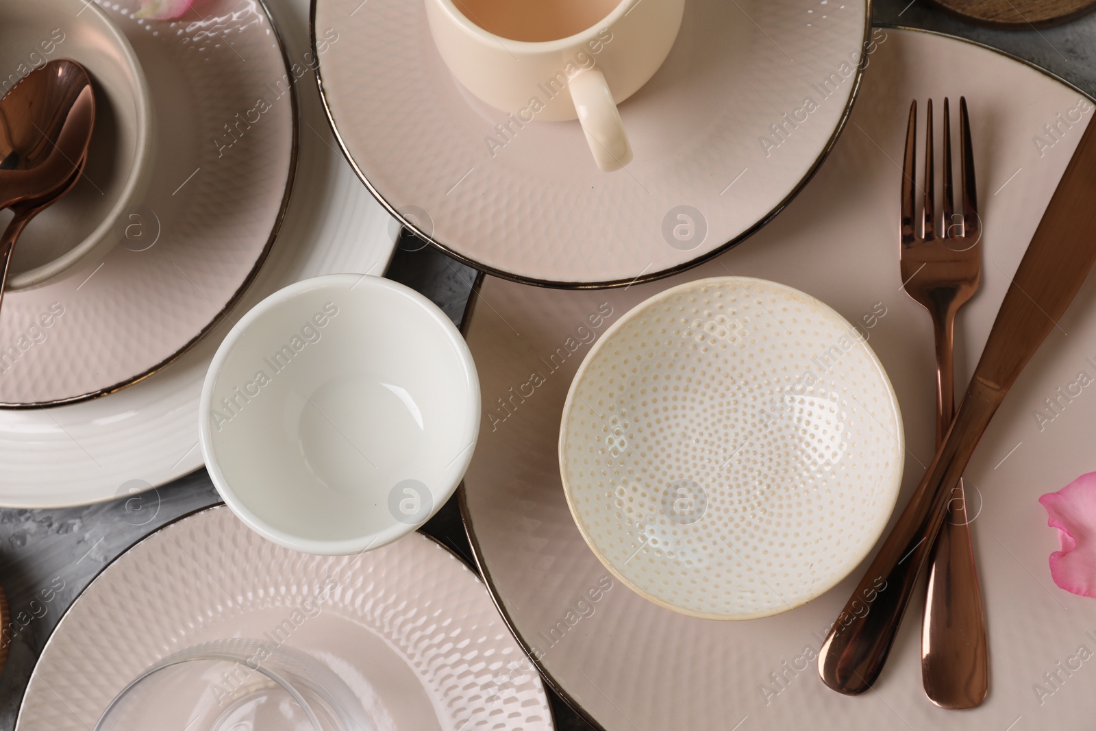 Photo of Stylish table setting with cutlery, cups and dishes, flat lay