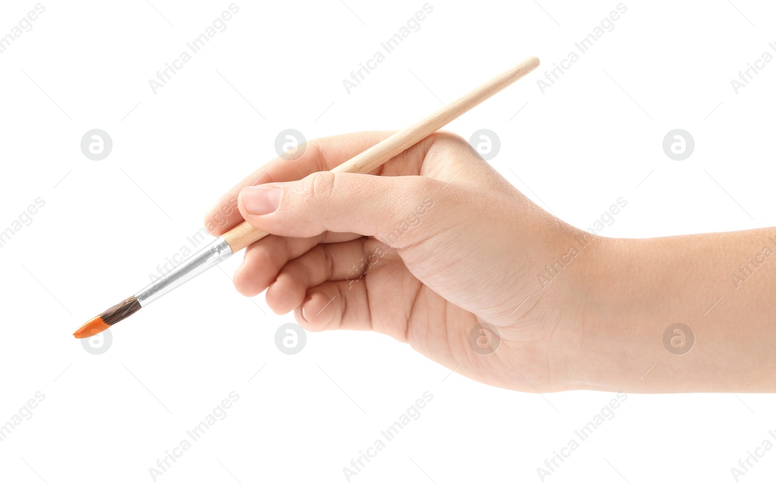 Photo of Young woman holding brush with color paint on white background, closeup