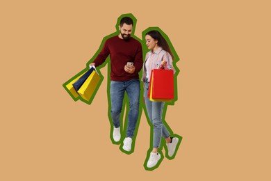 Image of Happy couple with shopping bags looking at smartphone and jumping on beige background