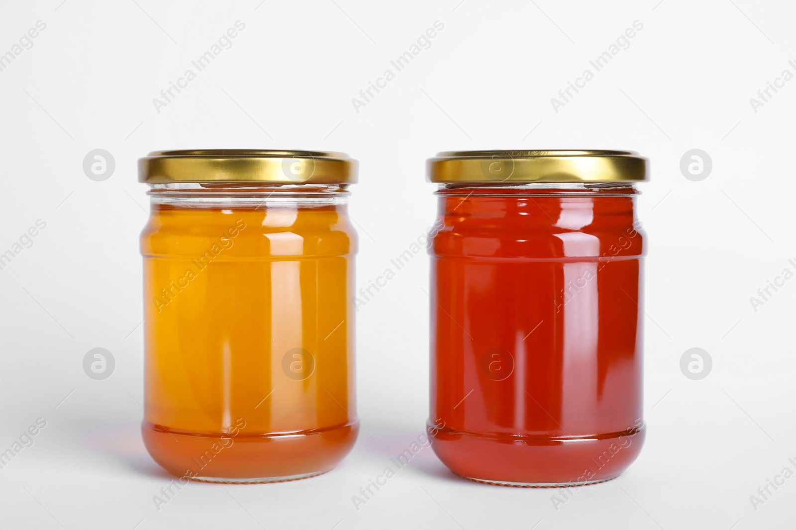 Photo of Different types of honey isolated on white