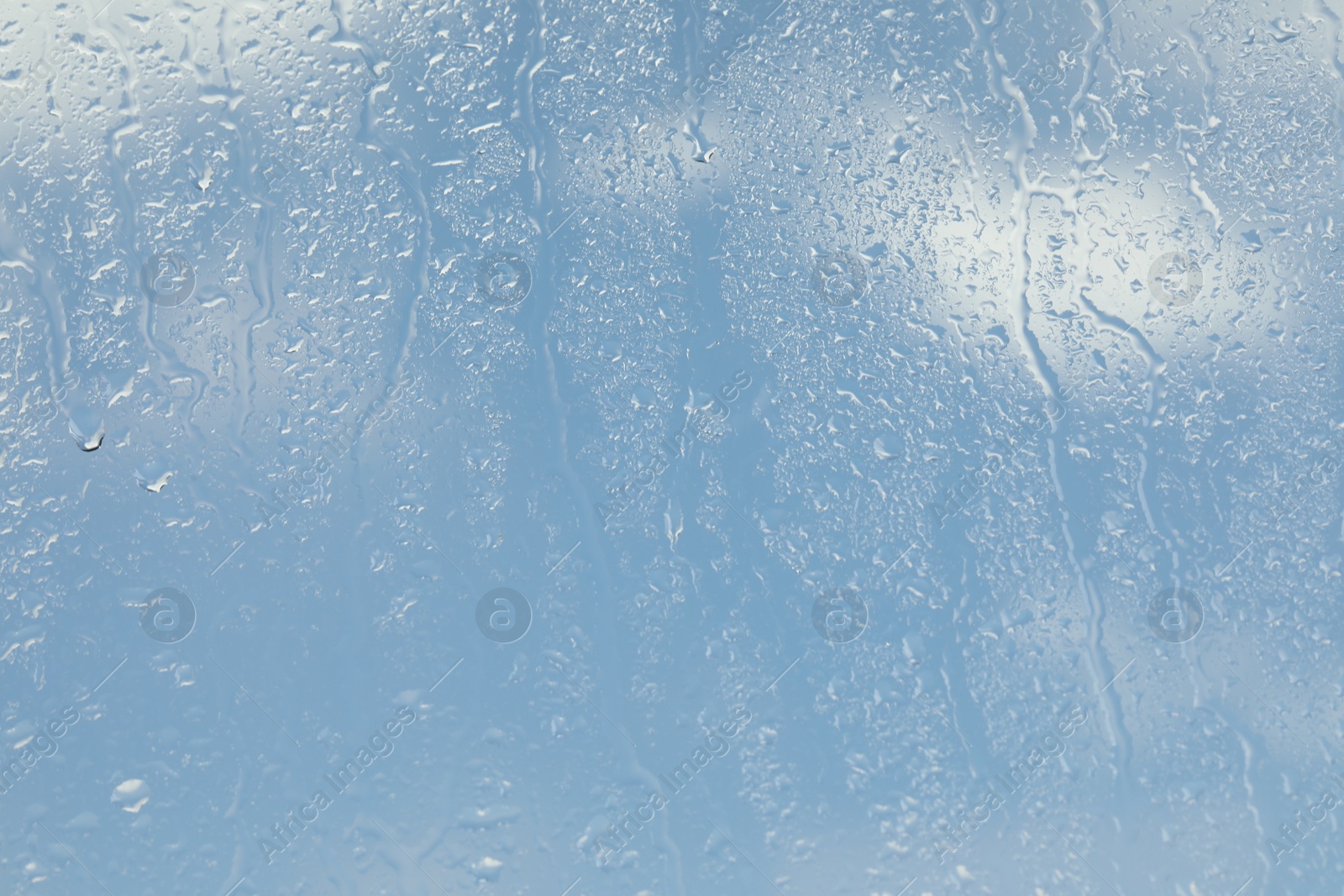 Photo of Window glass with raindrops as background, closeup