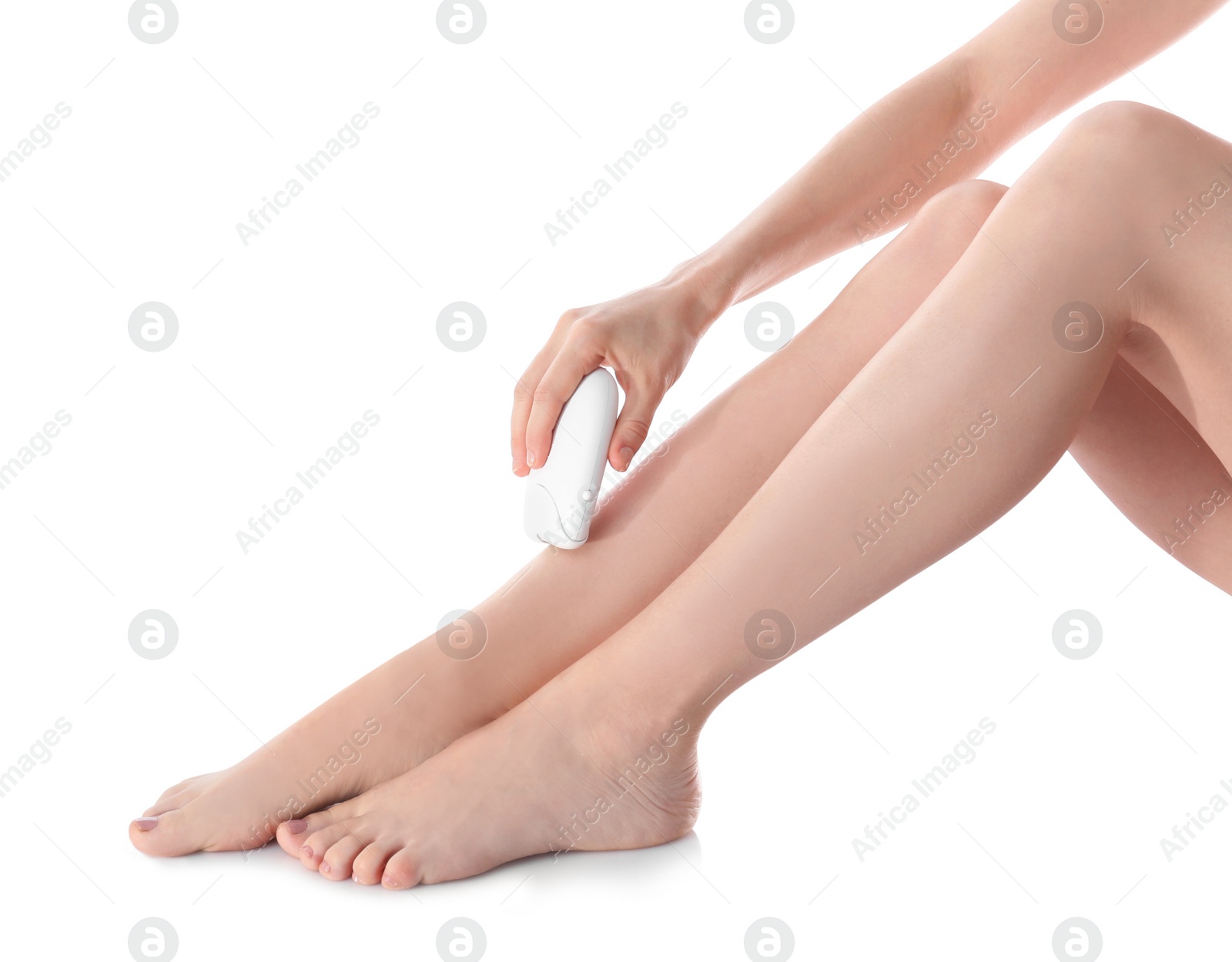 Photo of Young woman doing leg epilation procedure on white background, closeup