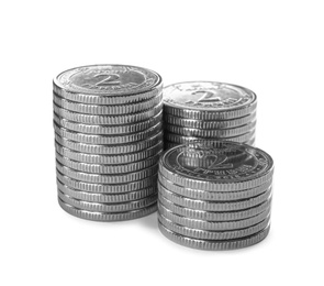 Photo of Stacks of Ukrainian coins on white background. National currency