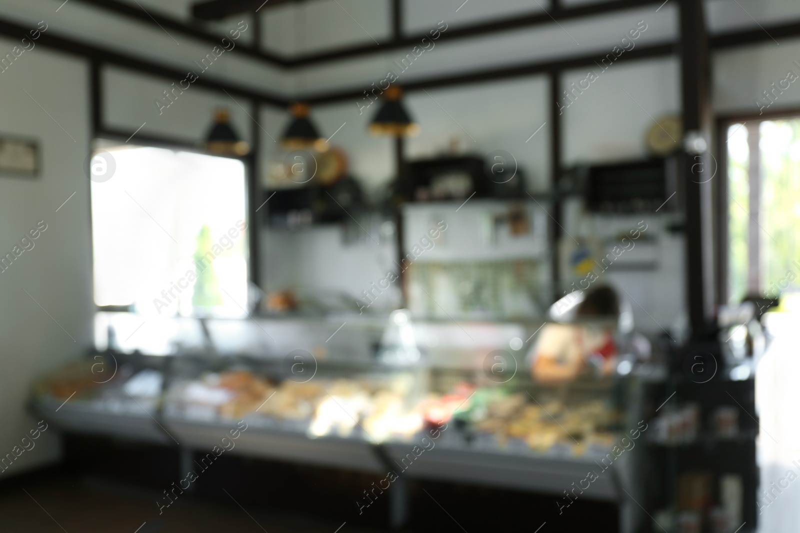 Photo of Blurred view of showcases with different products in store