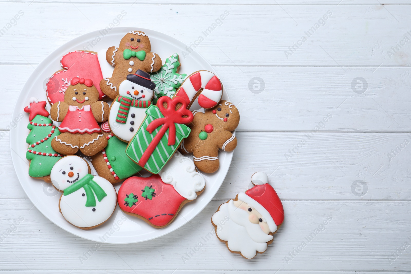 Photo of Delicious Christmas cookies on white wooden table, flat lay. Space for text