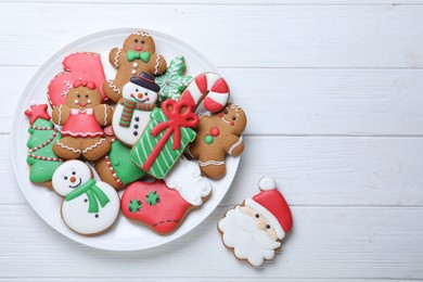 Photo of Delicious Christmas cookies on white wooden table, flat lay. Space for text