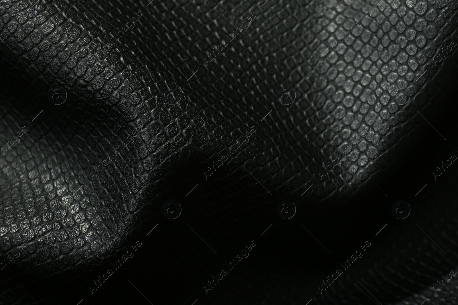 Photo of Black natural leather as background, above view