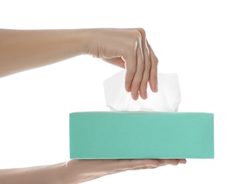 Woman taking paper tissue from box on white background, closeup