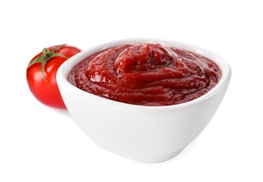 Tasty ketchup in bowl and fresh tomato isolated on white, closeup