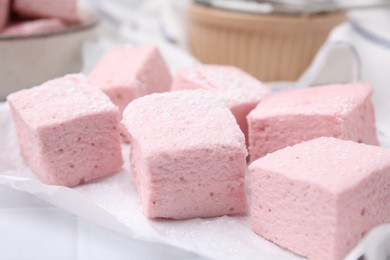 Delicious sweet marshmallows on white table, closeup