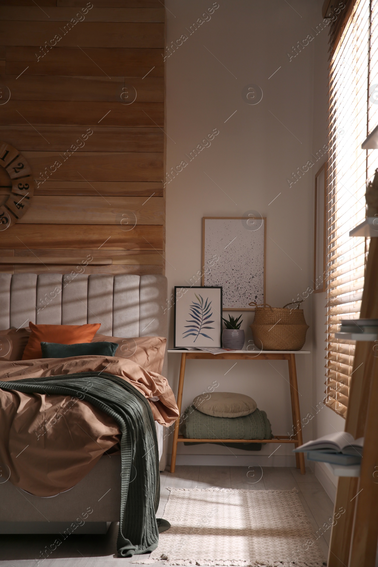 Photo of Bed with stylish linen and soft pillows in room