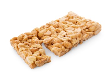 Photo of Pieces of tasty peanut bar (kozinaki) isolated on white
