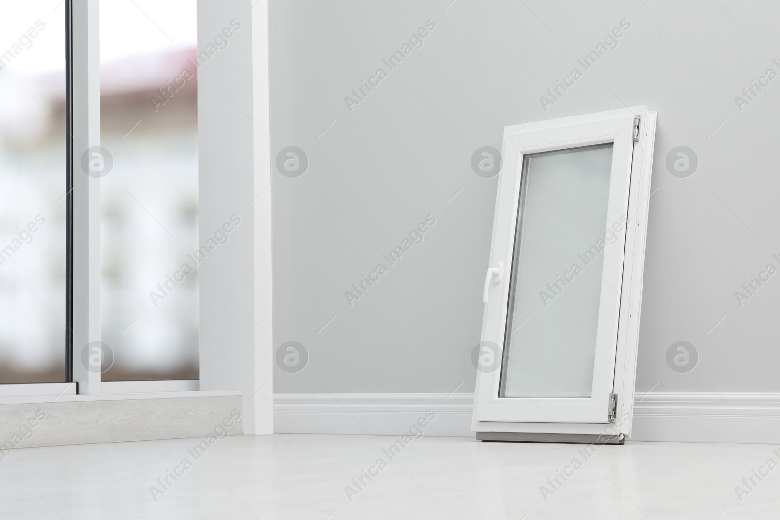 Photo of Modern single casement window near light grey wall indoors, space for text