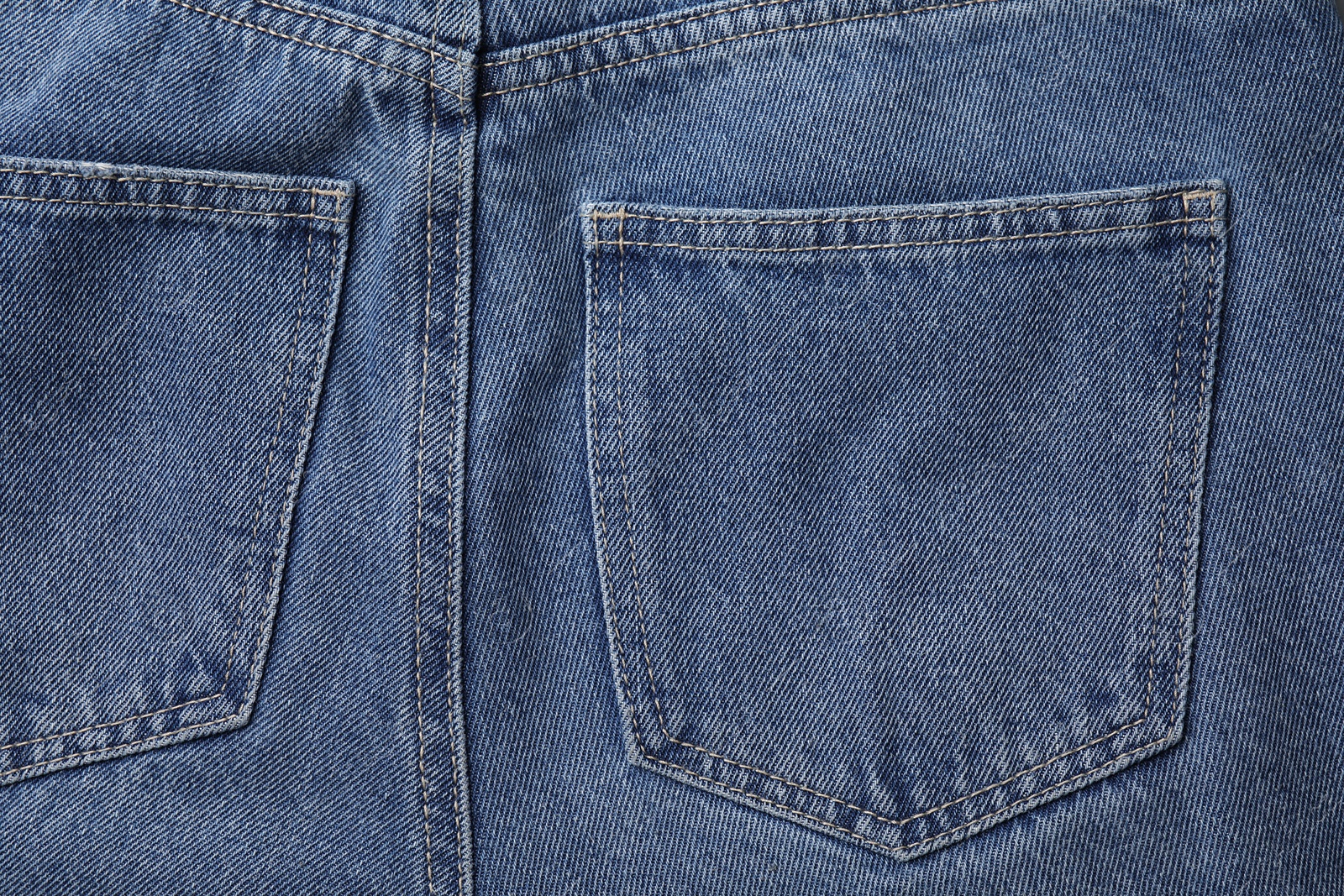 Photo of Jeans with pockets as background, top view
