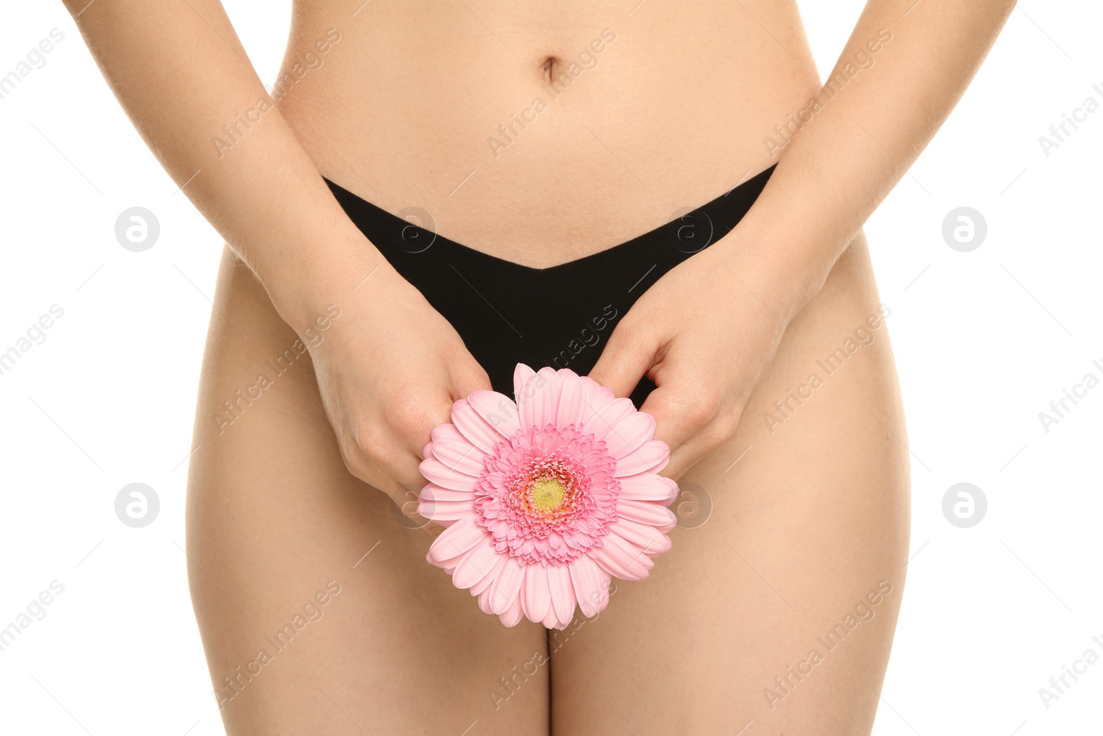 Photo of Gynecology. Woman in underwear with gerbera flower on white background, closeup