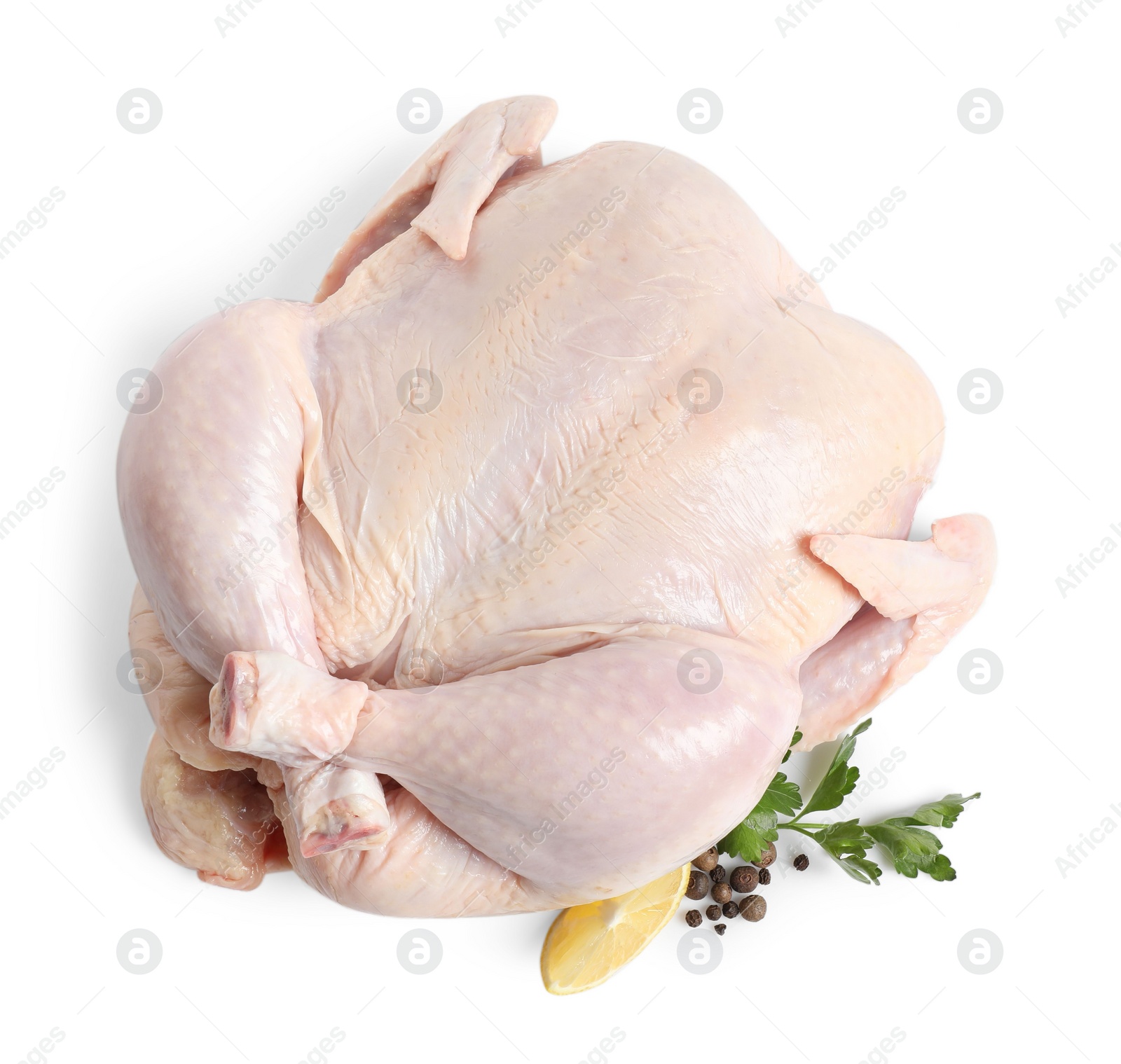 Photo of Fresh raw chicken with lemon and spices isolated on white, top view