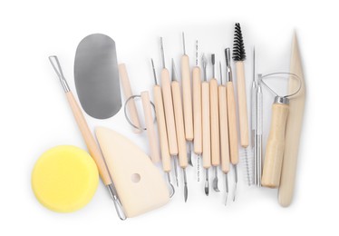 Photo of Set of different clay crafting tools isolated on white, top view