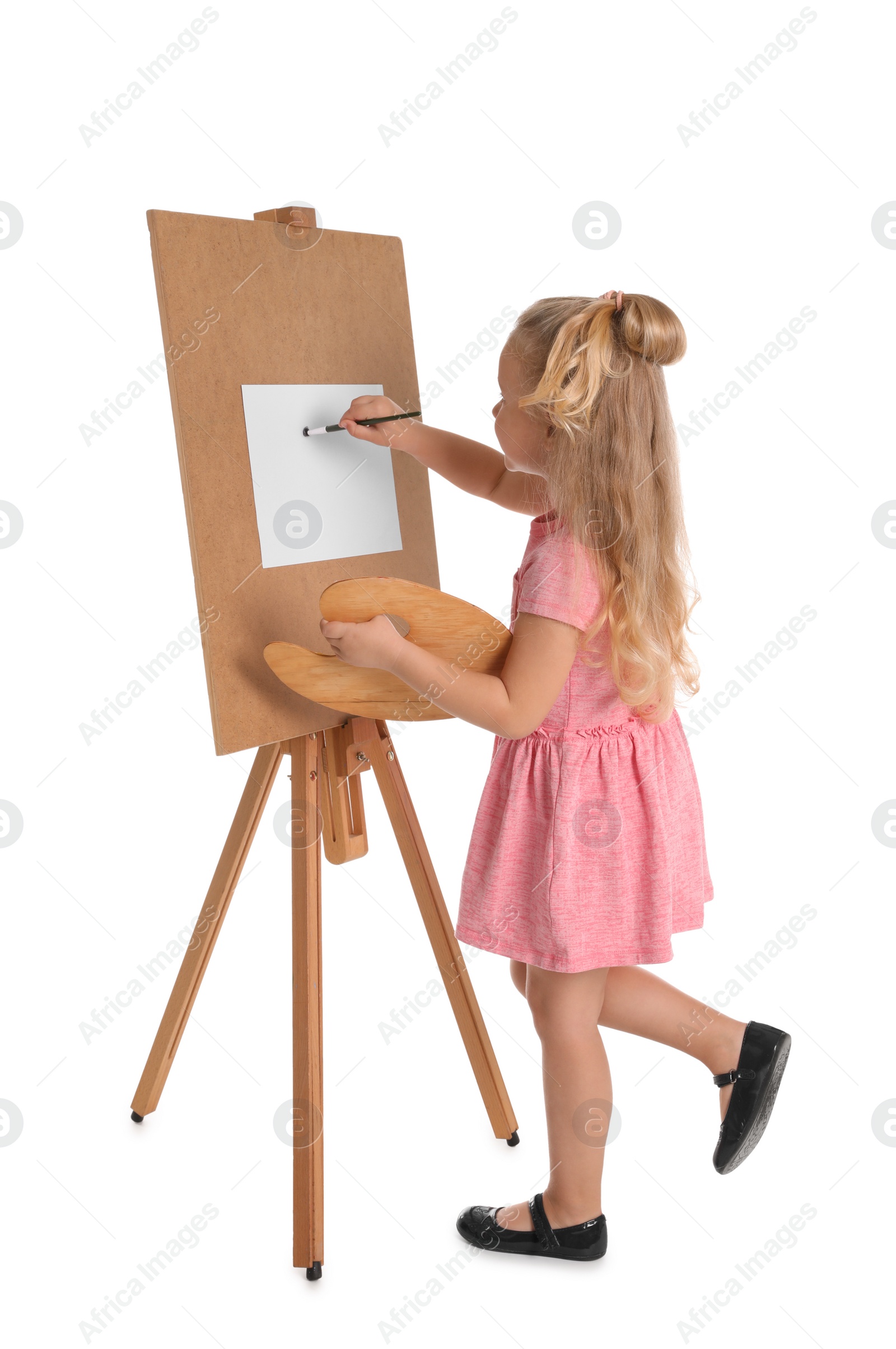 Photo of Child painting picture on easel against white background. Space for text