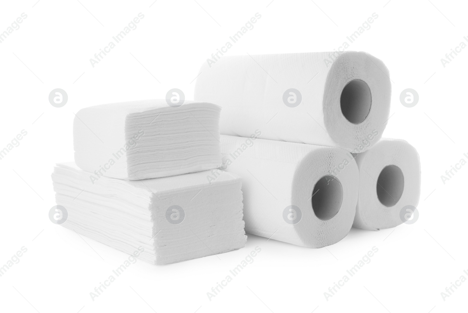 Photo of Rolls and stacks of paper towels isolated on white