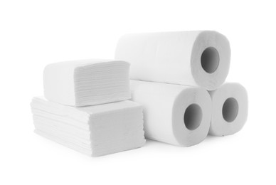 Photo of Rolls and stacks of paper towels isolated on white