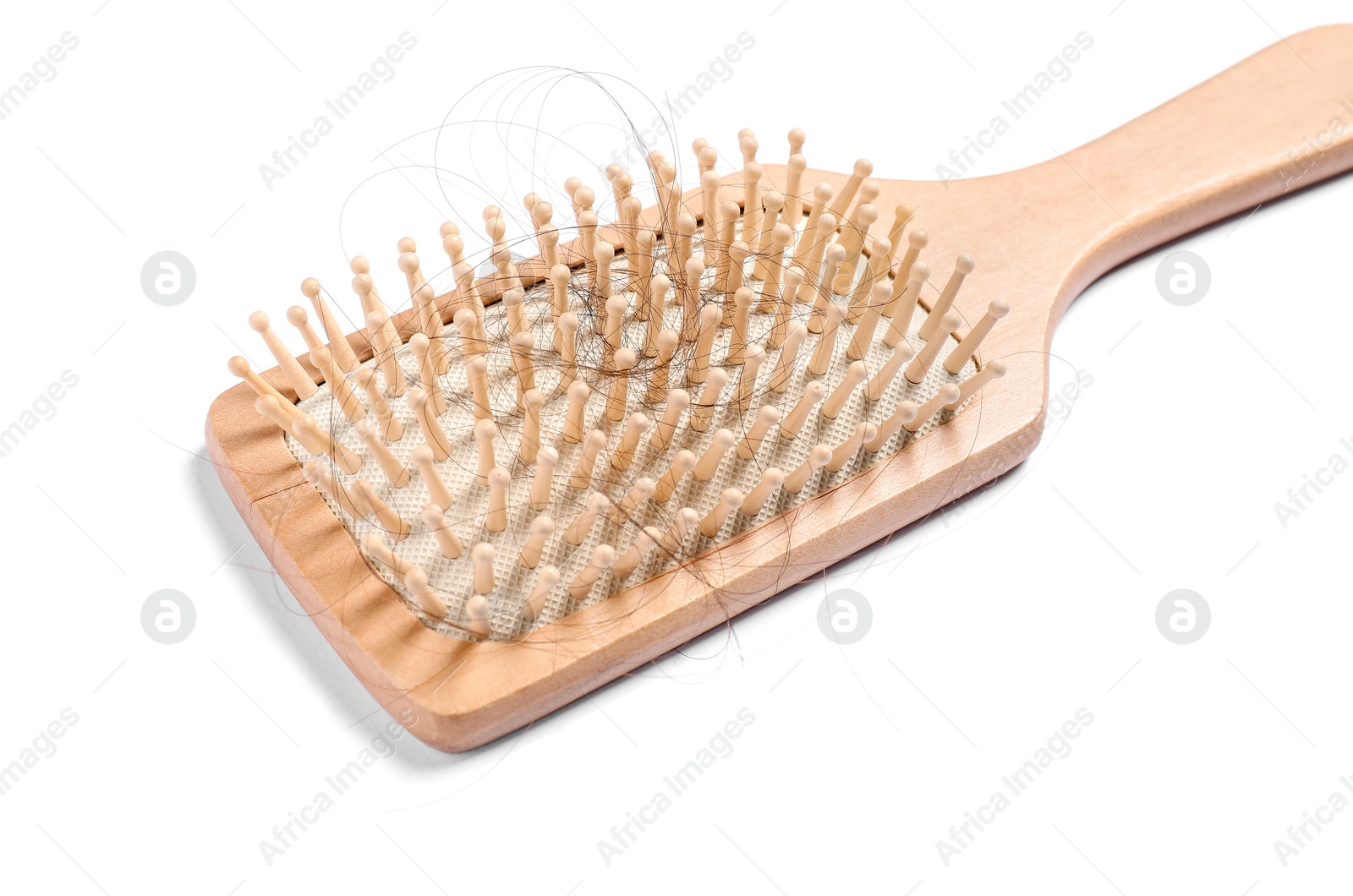 Photo of Wooden brush with lost hair isolated on white