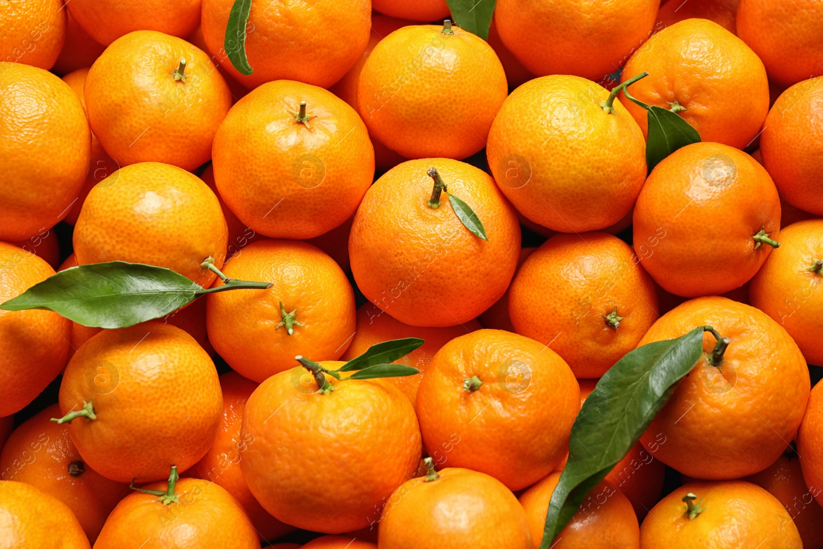 Photo of Delicious fresh ripe juicy tangerines as background