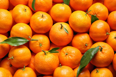 Photo of Delicious fresh ripe juicy tangerines as background