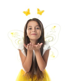 Photo of Cute little girl in fairy costume with yellow wings on white background