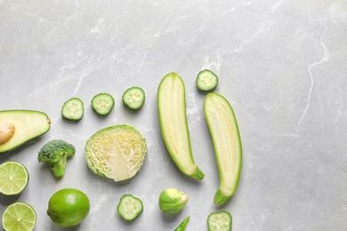 Photo of Flat lay composition with fresh vegetables and fruits on light background