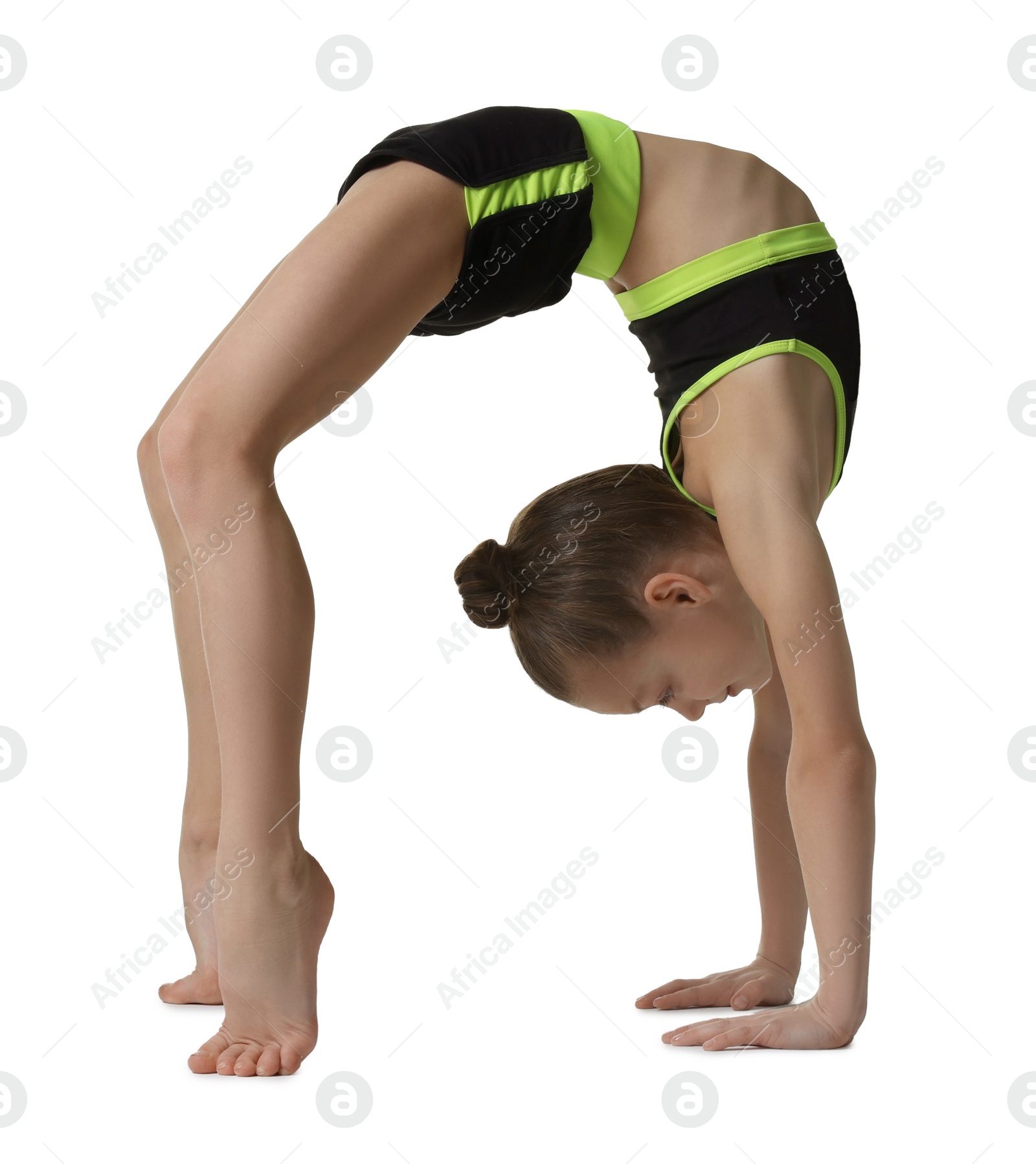 Photo of Cute little girl doing gymnastic exercise on white background