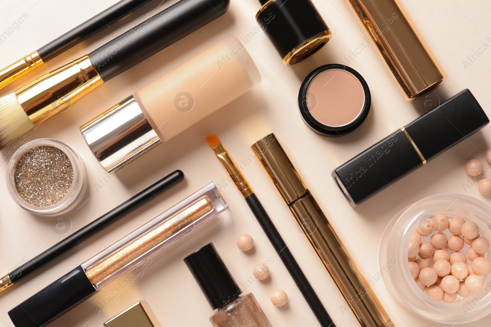 Photo of Different luxury makeup products on color background, flat lay