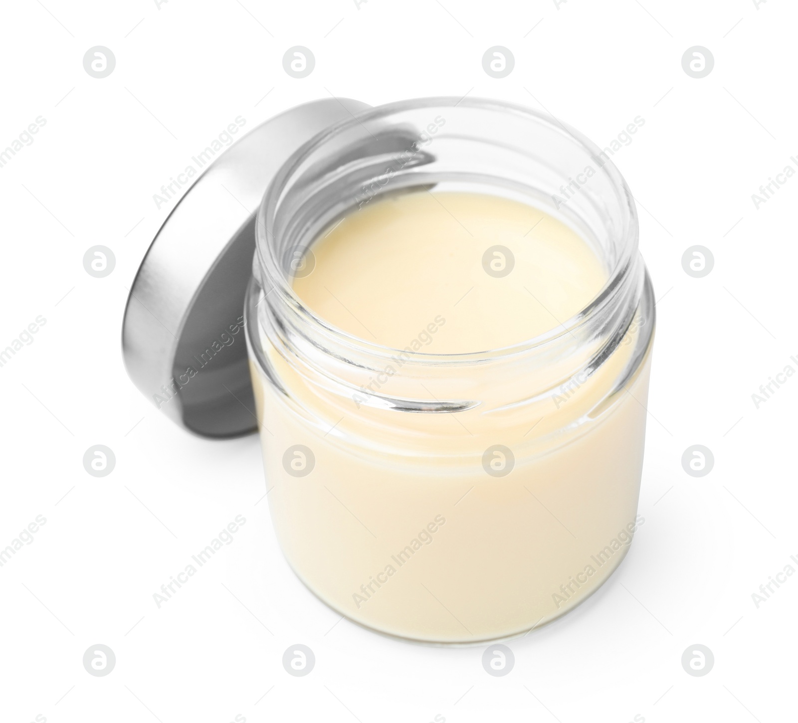 Photo of Open jar with condensed milk isolated on white