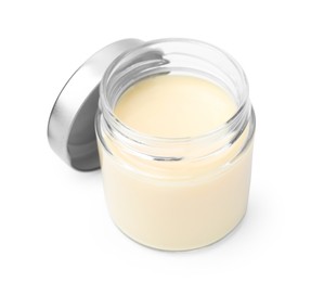 Photo of Open jar with condensed milk isolated on white