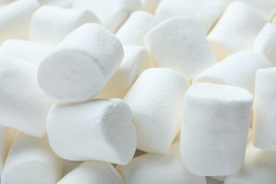 Photo of Delicious white puffy marshmallows as background, closeup