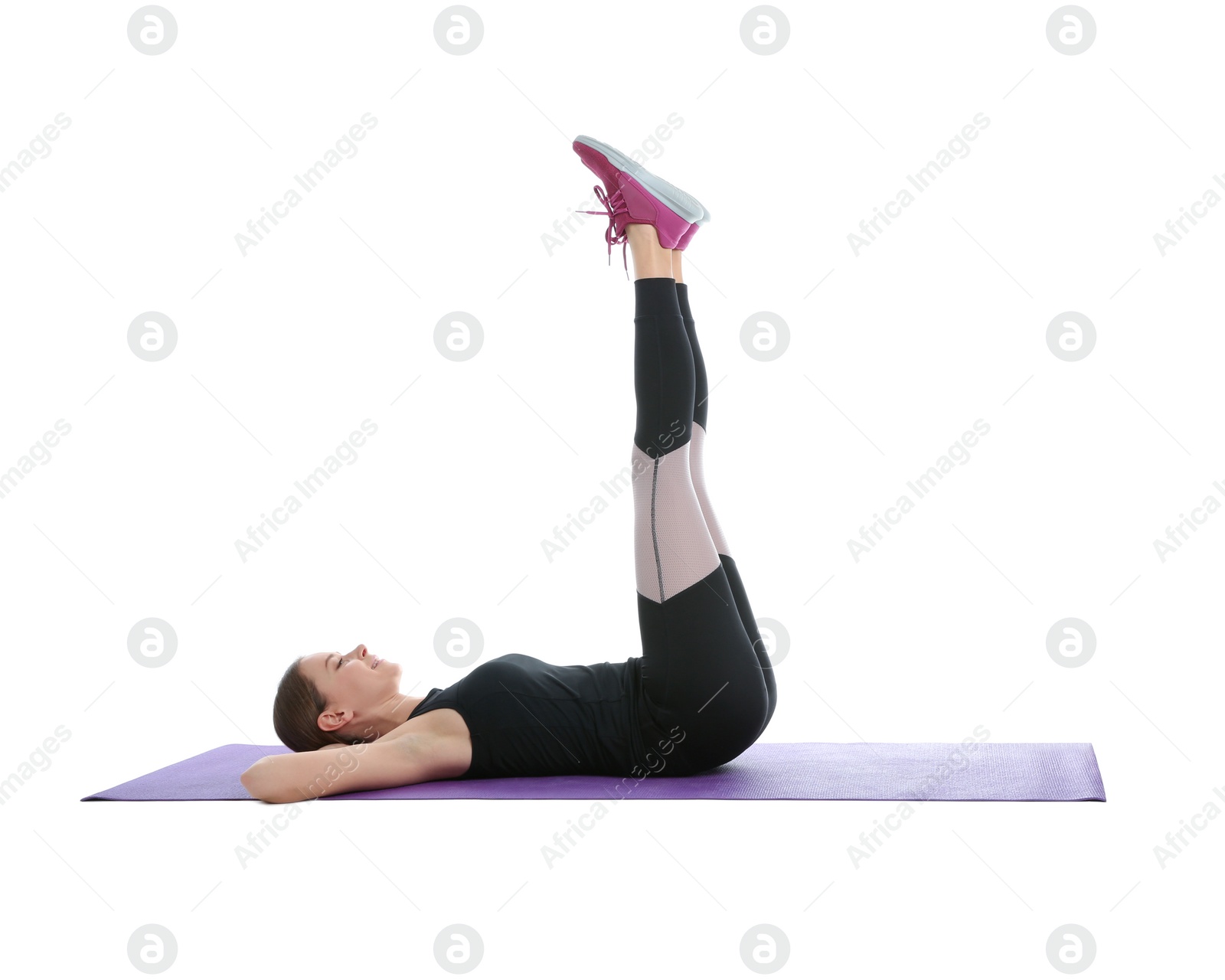 Photo of Young woman doing sports exercises isolated on white. Home fitness