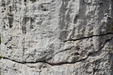 Photo of Closeup view of grey stone surface as background