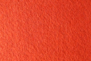 Photo of Orange textured surface as background, closeup view