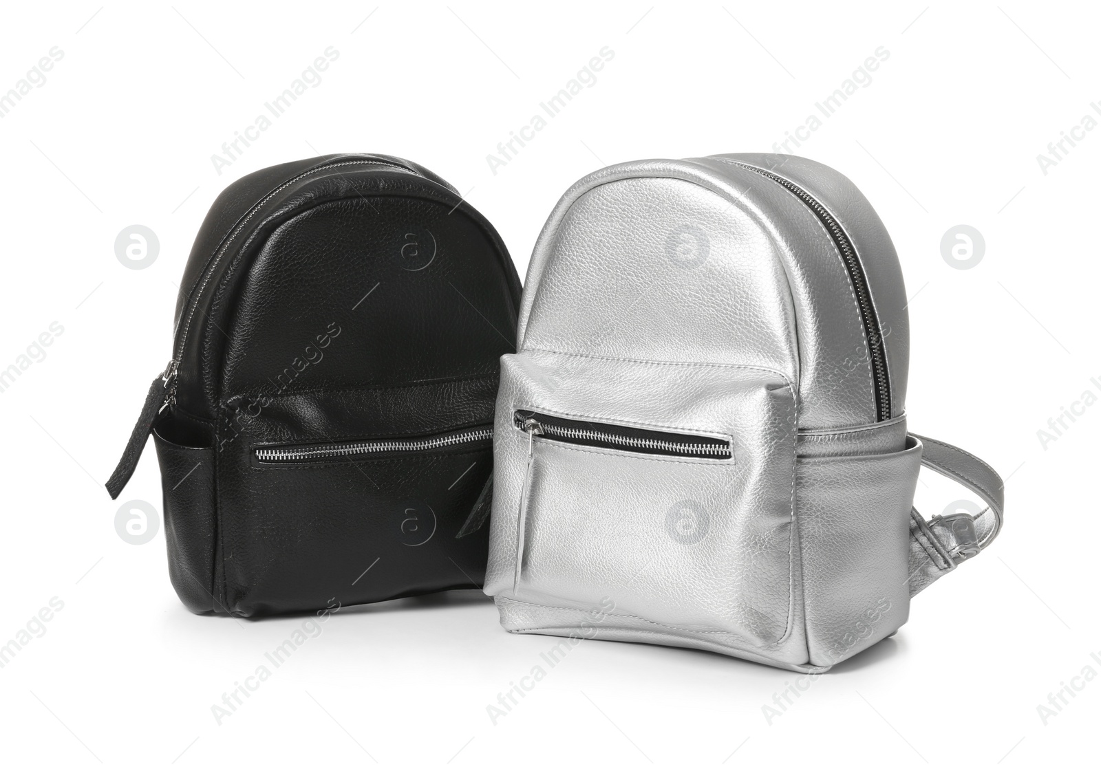 Photo of New stylish modern backpacks on white background