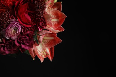 Beautiful fresh flowers on dark background, space for text