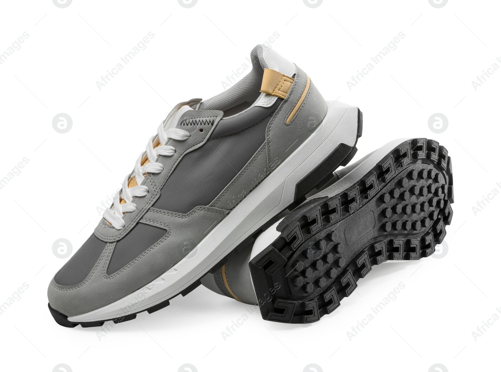 Photo of Pair of stylish grey sneakers isolated on white