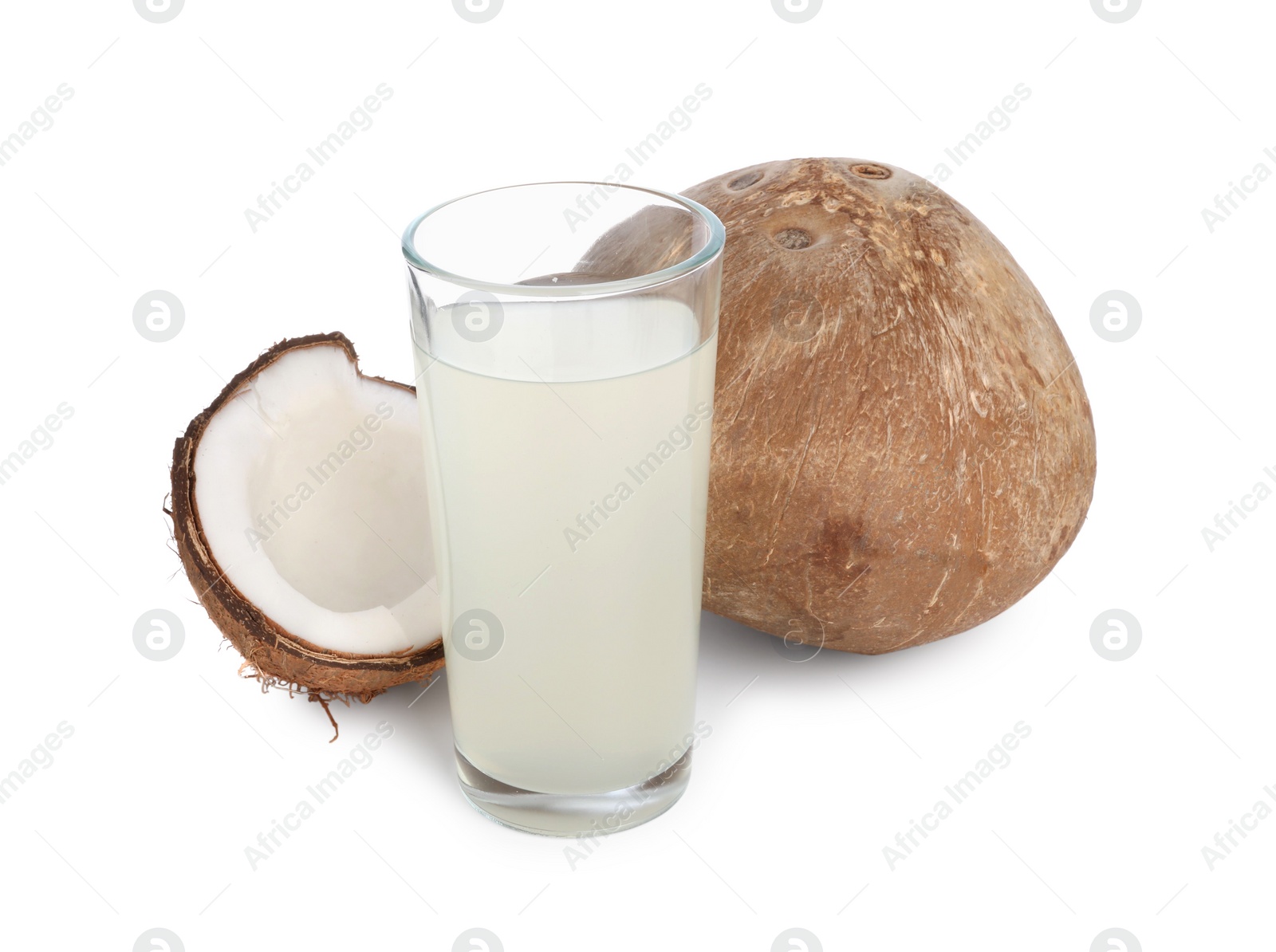 Photo of Glass of coconut water and nuts isolated on white