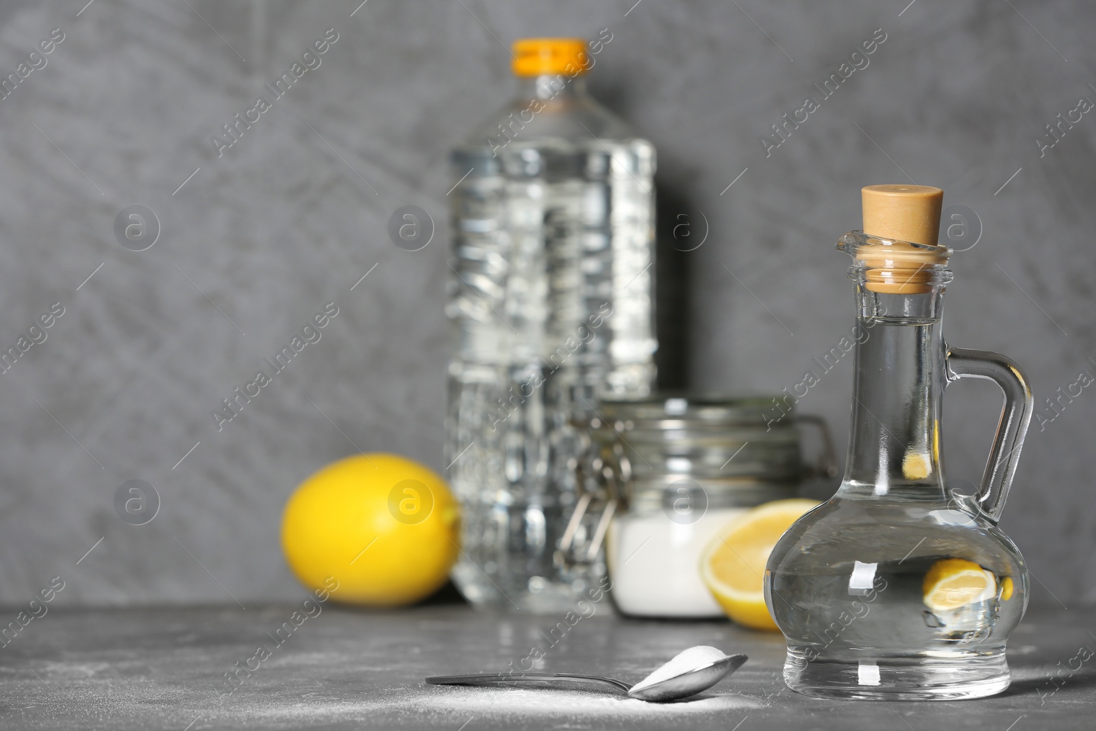 Photo of Composition with vinegar and baking soda on table. Space for text