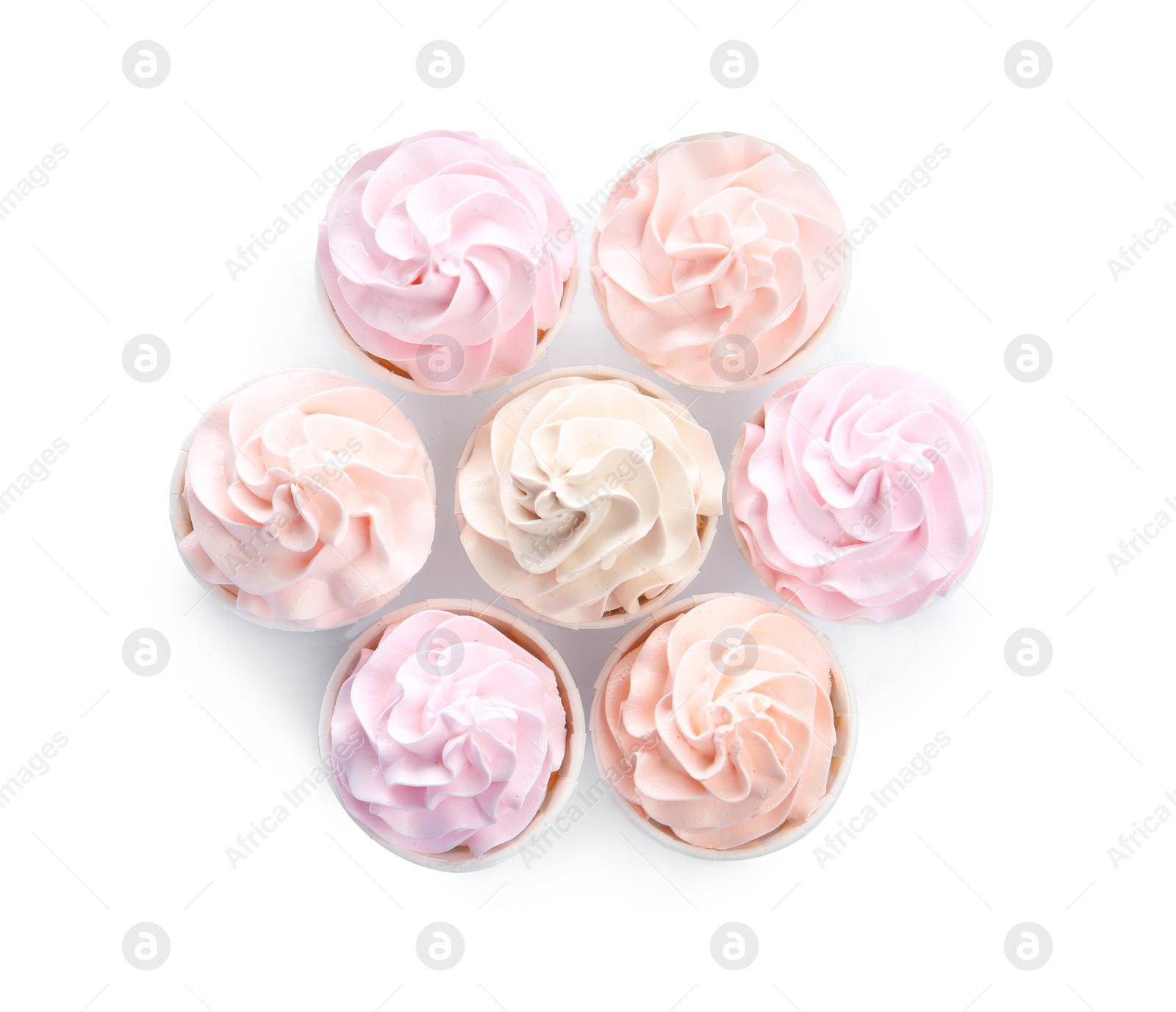 Photo of Tasty cupcakes isolated on white, top view