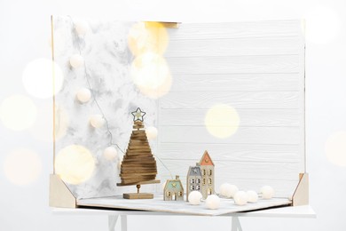 Christmas decor and double-sided backdrops on table in photo studio, bokeh effect