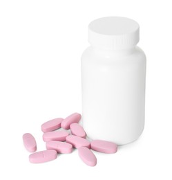 Photo of Bottle and pile of vitamin pills isolated on white