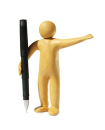 Human figure made of yellow plasticine holding pen isolated on white