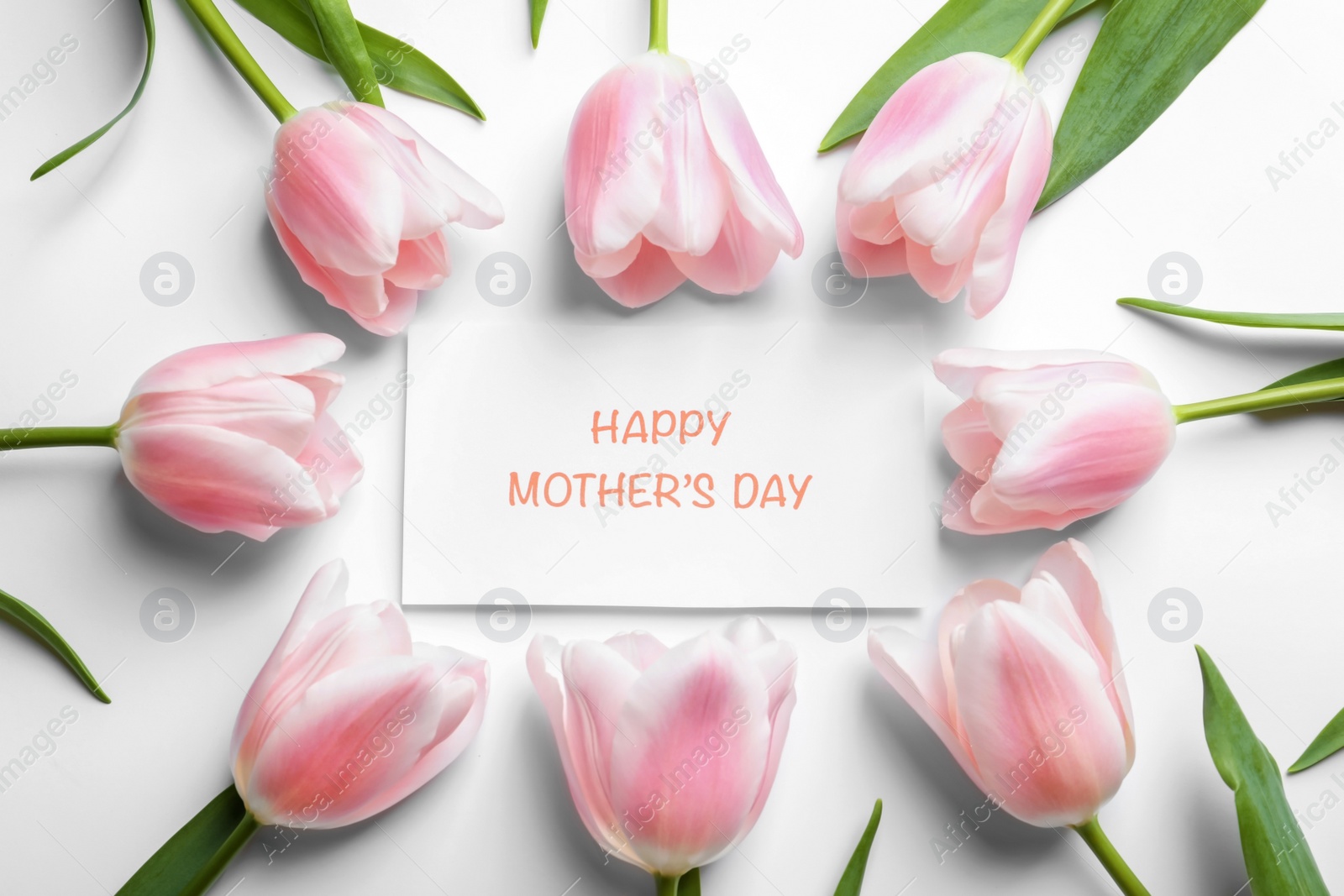 Photo of Beautiful tulips and greeting card with words "Happy Mother's Day" on light background, top view