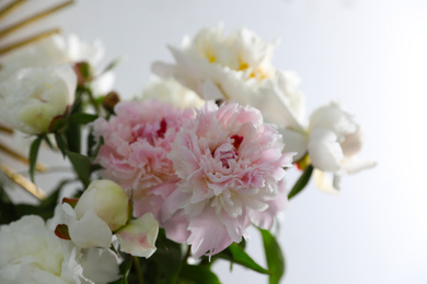 Photo of Bouquet of beautiful peony flowers on light background, closeup