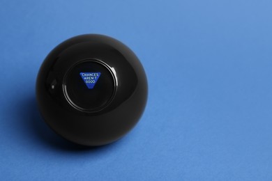 Photo of Magic eight ball with prediction Chances Arenʼt Good on blue background, space for text